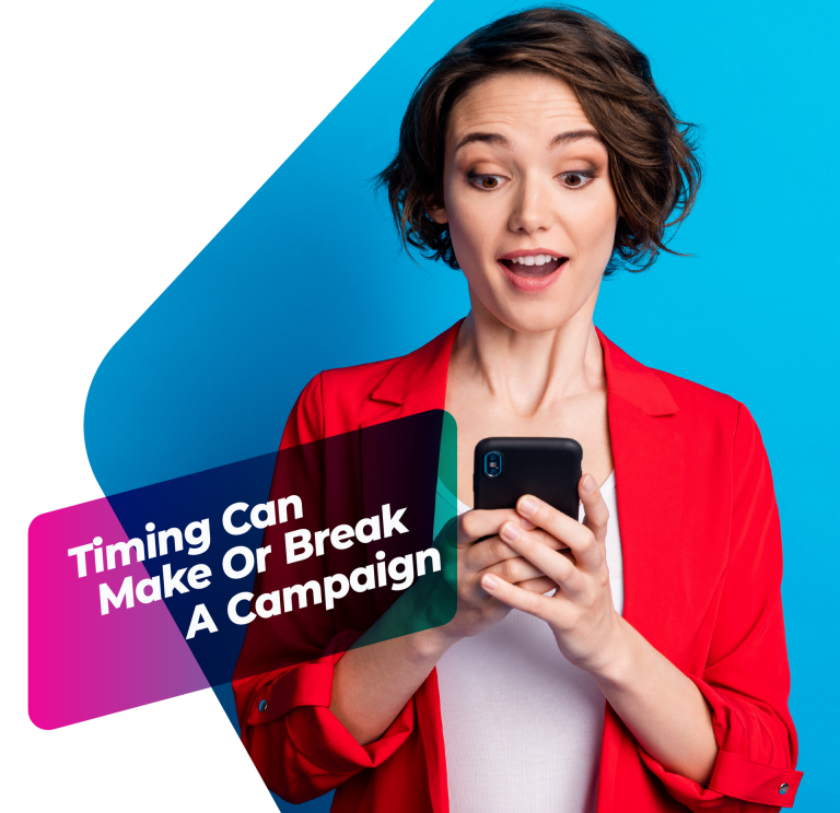 A marketer looking at her smartphone with a surprised expression, representing real-time reaction to trending content.
